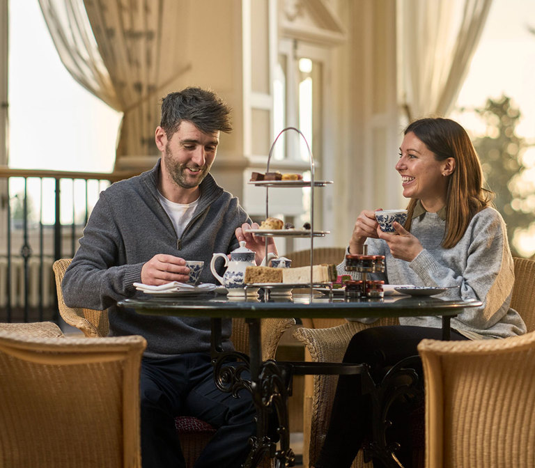 Couple eating afternoon tea